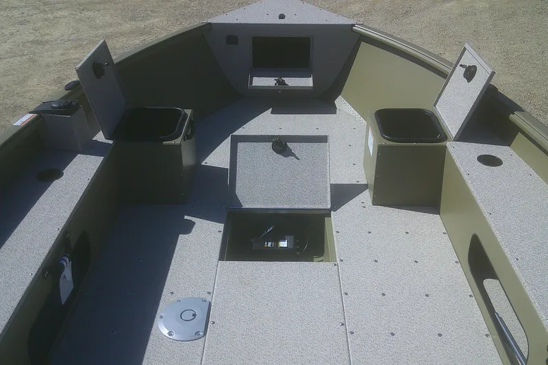 Slide: The Image of 2026 Lund 1875 Alaskan Tiller boat interior with storage compartments and seating. - 4