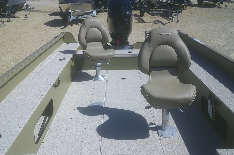 Slide: The Image of 2026 Lund 1875 Alaskan Tiller boat interior with two swivel seats. - 6