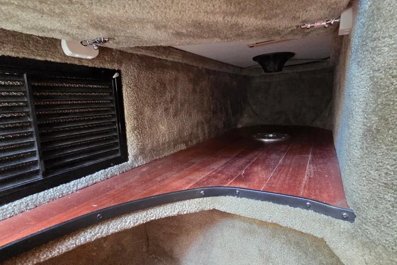 Slide: The Image of Interior cabin of 2013 Crownline 325 SCR boat with wood flooring and vent. - 21