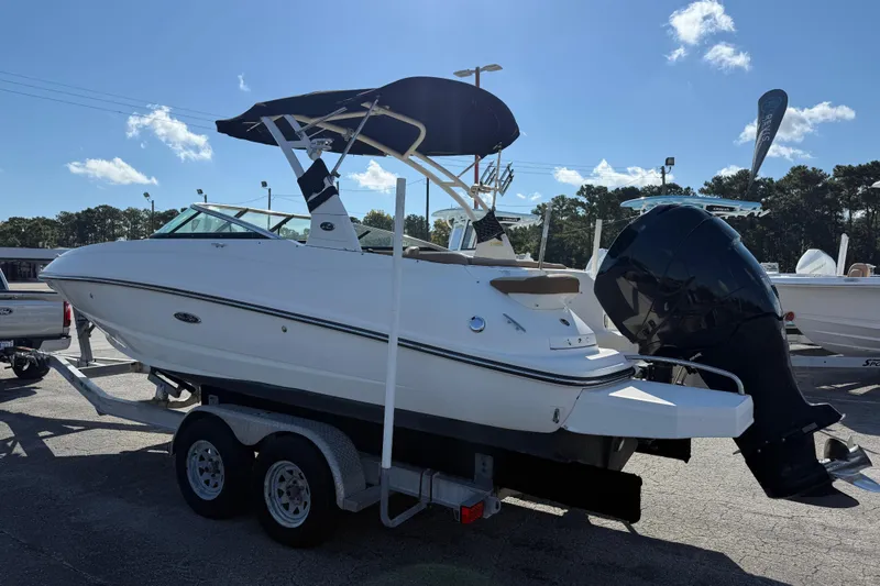 Slide: The Image of 2014 Sea Ray 240 Sundeck Outboard on trailer, featuring sleek design and powerful engine. - 11