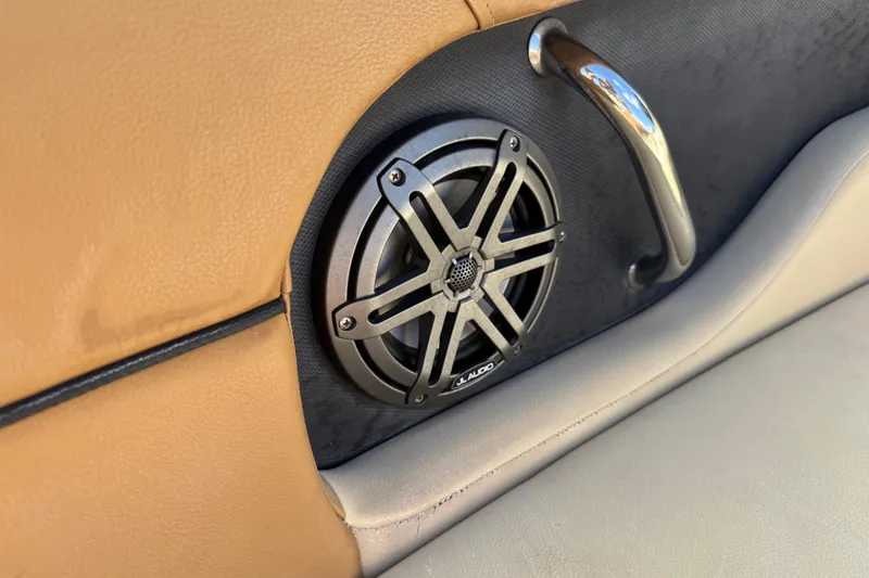 Slide: The Image of Speaker and handle detail on 2014 Sea Ray 240 Sundeck Outboard boat interior. - 14