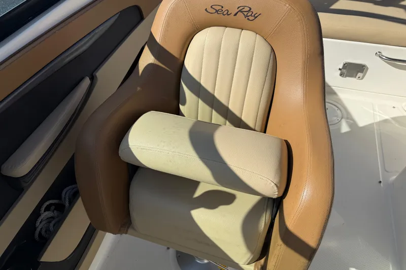 Slide: The Image of Captain's chair on 2014 Sea Ray 240 Sundeck Outboard, featuring tan upholstery. - 21