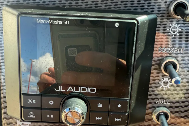 Slide: The Image of JL Audio MediaMaster 50 on 2014 Sea Ray 240 Sundeck Outboard dashboard. - 24