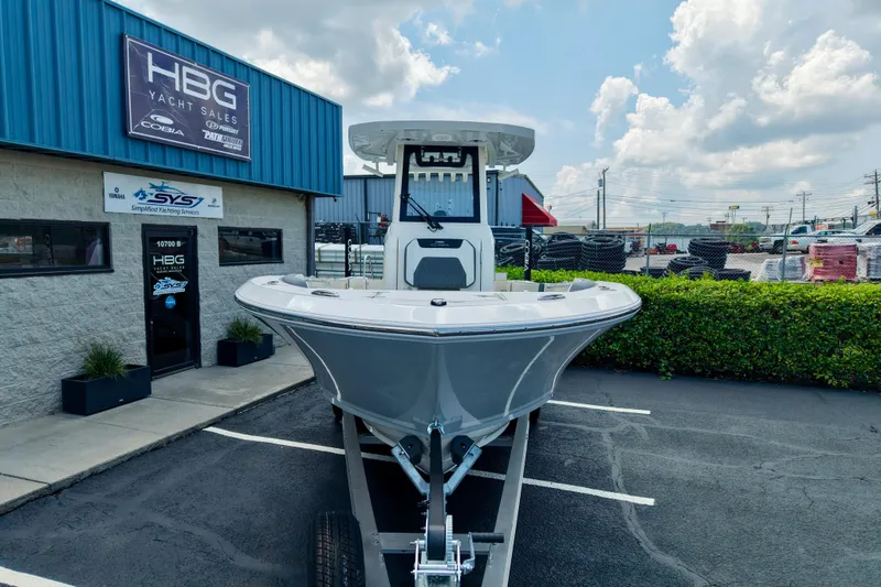 Slide: The Image of 2027 Cobia 245 Center Console boat displayed at HBG Yacht Sales dealership. - 21