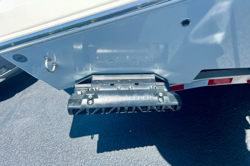 Slide: The Image of 2027 Cobia 245 Center Console with Seakeeper stabilizer on trailer. - 9