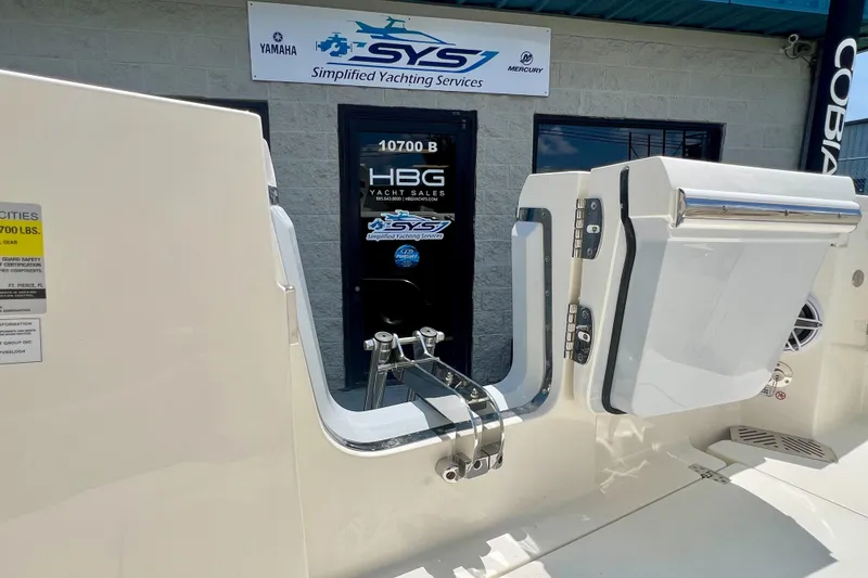 Slide: The Image of 2027 Cobia 245 Center Console boat at yacht sales service center. - 6