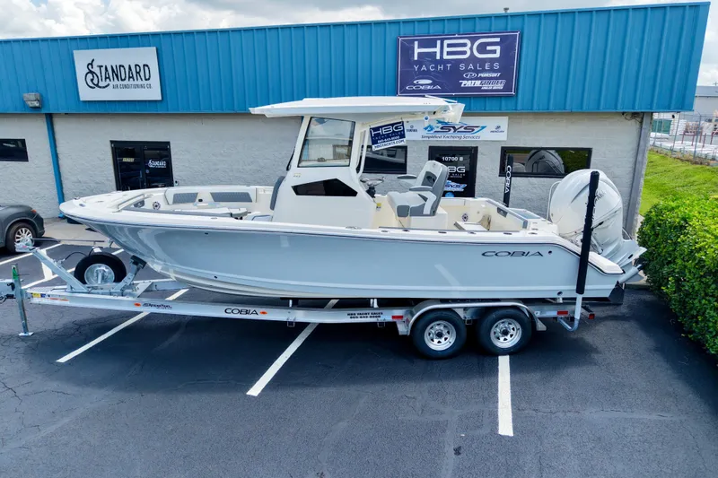 Slide: The Image of 2027 Cobia 245 Center Console boat on trailer at HBG Yacht Sales. - 26