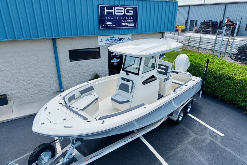 Slide: The Image of 2027 Cobia 245 Center Console boat on trailer at yacht sales lot. - 24
