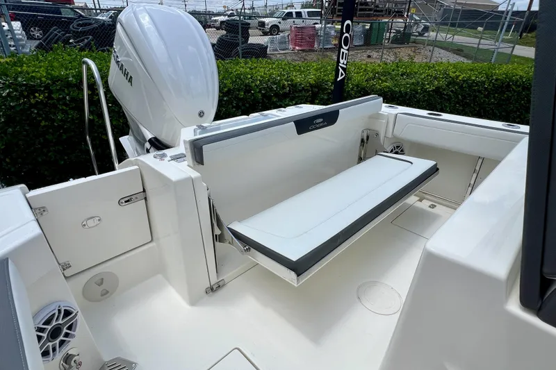 Slide: The Image of 2027 Cobia 245 Center Console boat with Yamaha engine and foldable seating. - 12