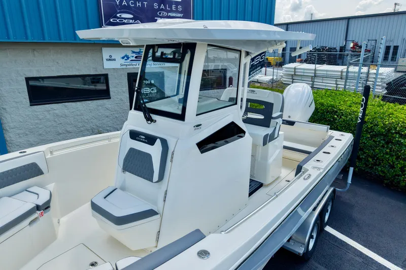 Slide: The Image of 2027 Cobia 245 Center Console boat displayed at yacht sales lot. - 3