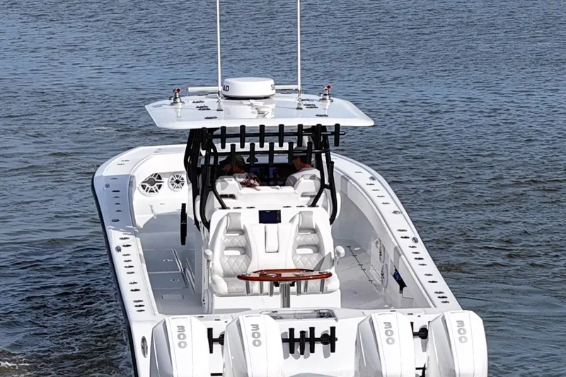 Slide: The Image of Luxury Freeman 37VH boat cruising on water, showcasing sleek design and powerful engines, 2022 model. - 10