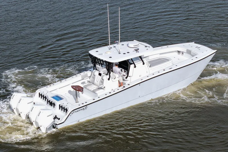 Slide: The Image of Freeman 37VH 2022 boat cruising on water, featuring multiple outboard engines. - 16