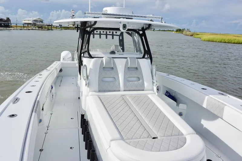 Slide: The Image of Luxury Freeman 37VH 2022 boat with sleek design and spacious seating on calm waters. - 20