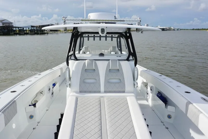 Slide: The Image of 2022 Freeman 37VH boat interior with luxurious seating on calm water. - 21