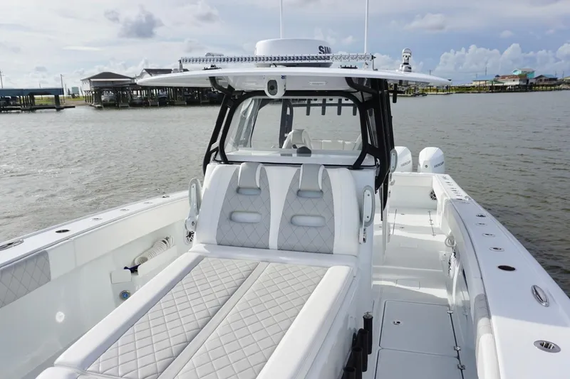 Slide: The Image of Luxurious 2022 Freeman 37VH boat with sleek design and spacious seating on calm waters. - 22