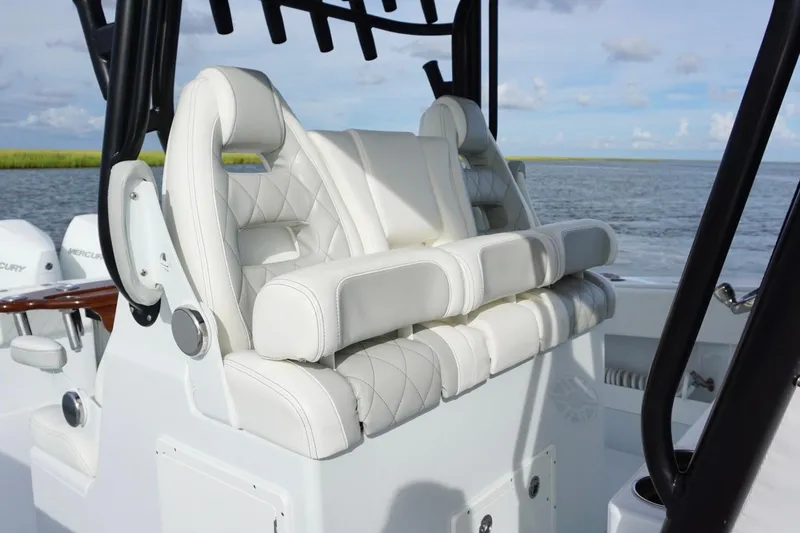 Slide: The Image of Luxurious seating on a 2022 Freeman 37VH boat, featuring white quilted upholstery. - 23