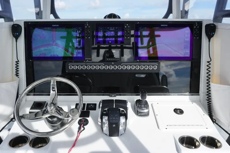 Slide: The Image of Helm of 2022 Freeman 37VH boat with dual Simrad displays and modern controls. - 25