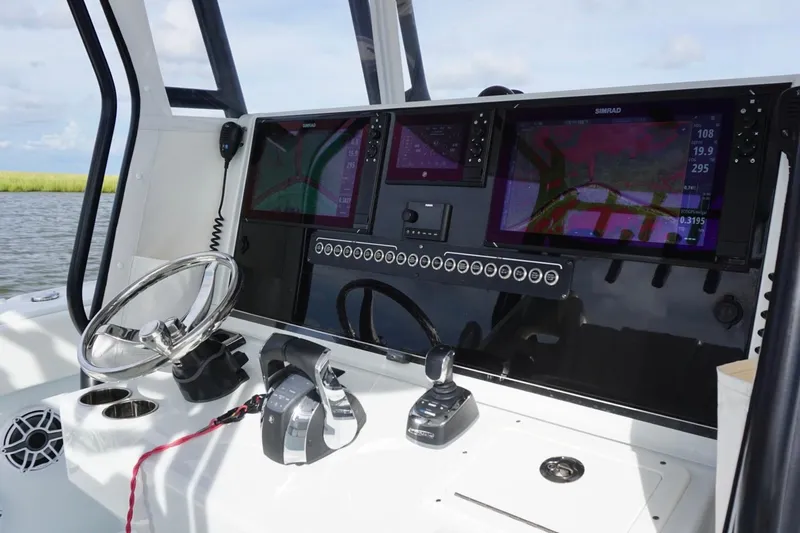 Slide: The Image of Control panel of 2022 Freeman 37VH boat with navigation screens and steering wheel. - 26