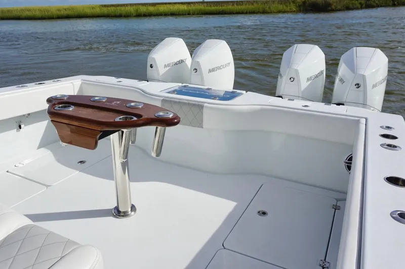 Slide: The Image of 2022 Freeman 37VH boat with Mercury engines, featuring a sleek fishing setup. - 29