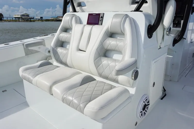 Slide: The Image of Luxurious seating on 2022 Freeman 37VH boat with quilted upholstery and armrests. - 31