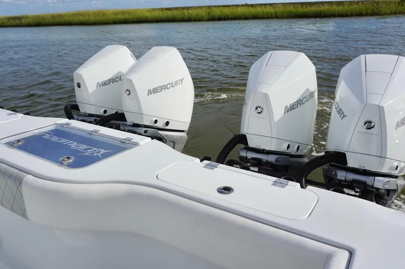 Slide: The Image of Freeman 37VH boat with four Mercury outboard engines on a calm waterway, 2022 model. - 37