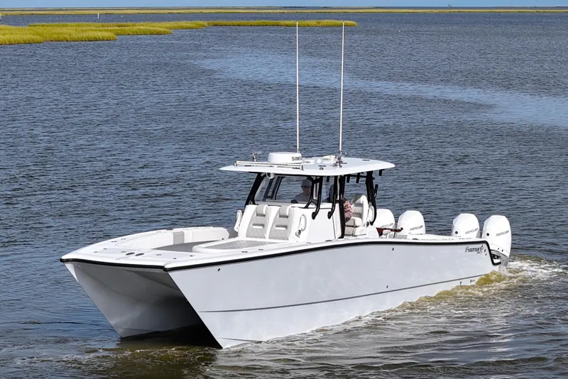 Slide: The Image of 2022 Freeman 37VH boat cruising on open water with quad engines. - 4