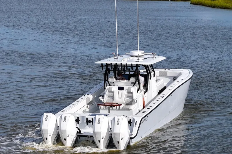 Slide: The Image of 2022 Freeman 37VH boat with quad engines cruising on water. - 9