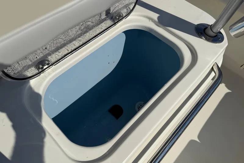 Slide: The Image of Livewell compartment on 2021 Mako 214 Center Console boat, open lid view. - 21
