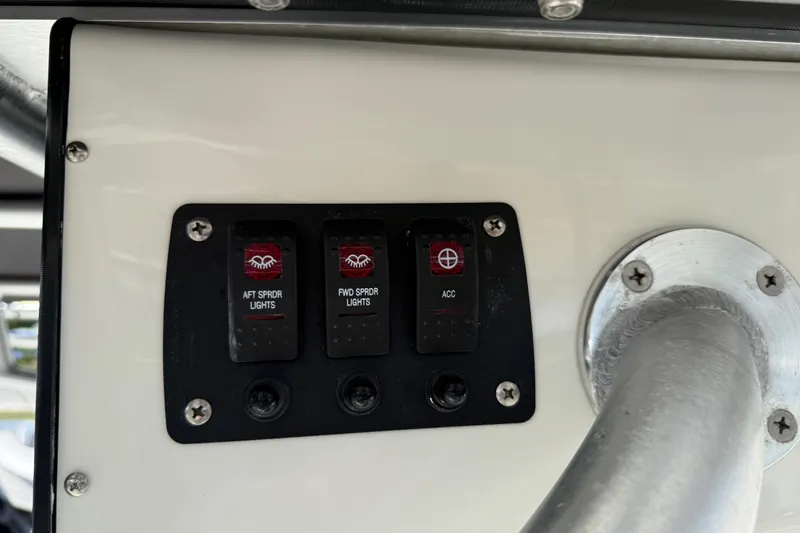 Slide: The Image of Control panel on 2021 Mako 214 Center Console boat with switches for lights and accessories. - 29