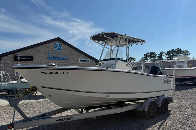 Slide: The Image of 2021 Mako 214 Center Console boat on trailer at Revis Yacht Sales. - 5