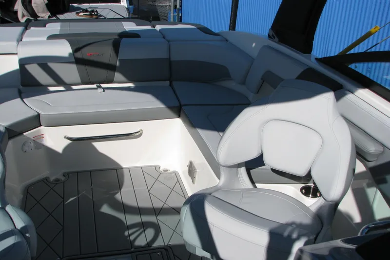 Slide: The Image of 2026 Chaparral 3 GTS boat interior with gray seating and modern design. - 11