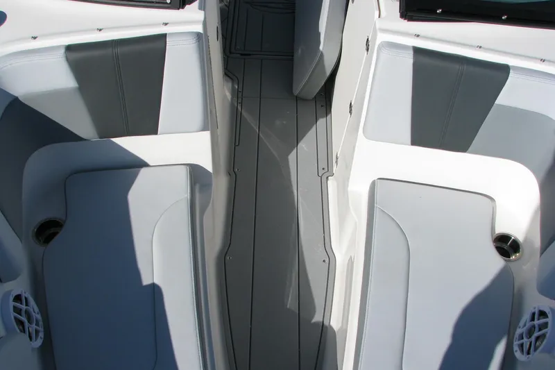 Slide: The Image of Interior seating of 2026 Chaparral 3 GTS boat with gray upholstery and cup holders. - 6