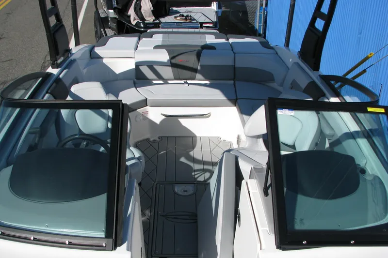 Slide: The Image of 2026 Chaparral 3 GTS boat interior with sleek seating and modern design. - 7
