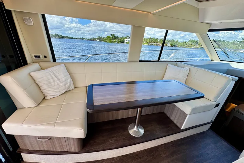 Slide: The Image of Luxurious interior of 2022 Regal 42 XO yacht with elegant seating and scenic water view. - 15