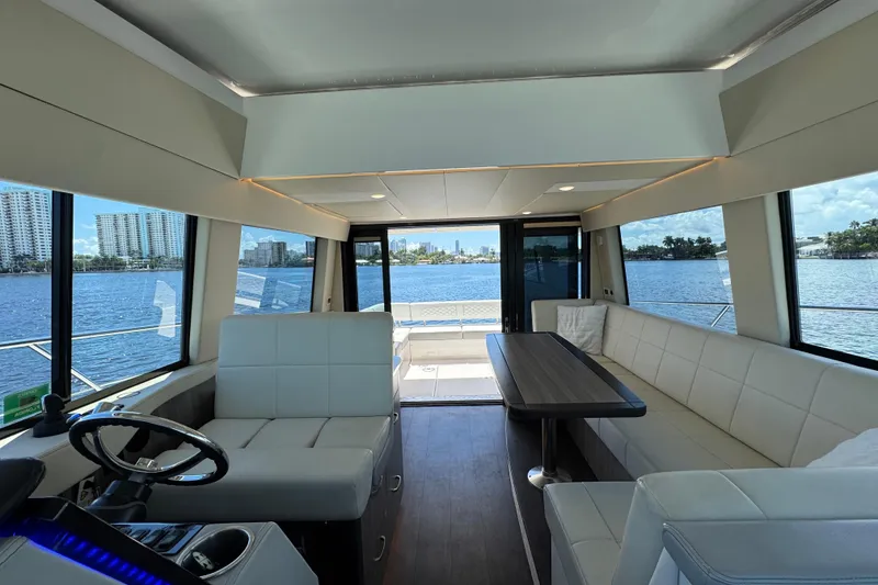 Slide: The Image of Luxurious interior of 2022 Regal 42 XO yacht with waterfront view. - 19