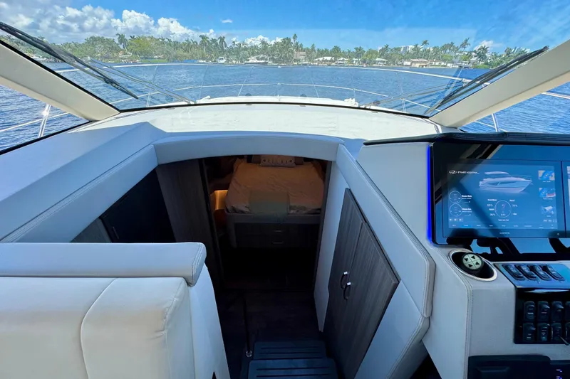 Slide: The Image of Interior view of 2022 Regal 42 XO yacht cockpit with navigation display. - 20