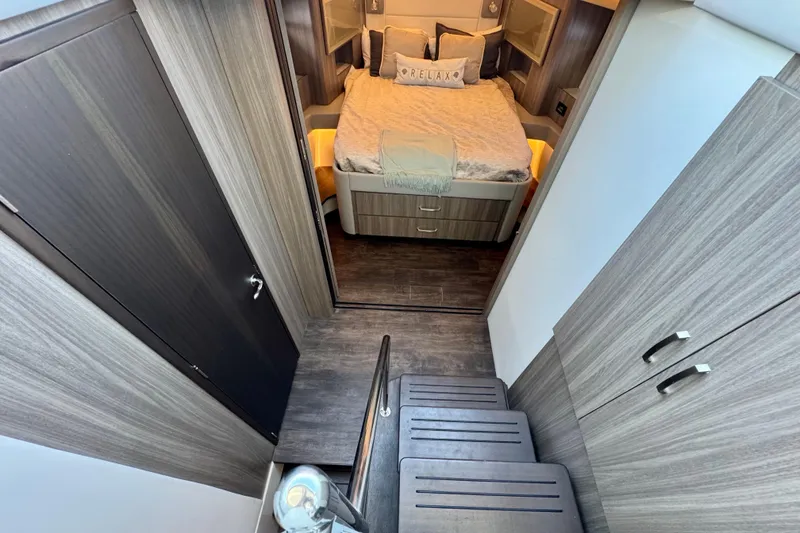 Slide: The Image of Luxurious interior of 2022 Regal 42 XO yacht with cozy bedroom and modern design. - 21
