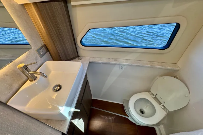 Slide: The Image of Luxurious bathroom in 2022 Regal 42 XO yacht with ocean view window. - 26