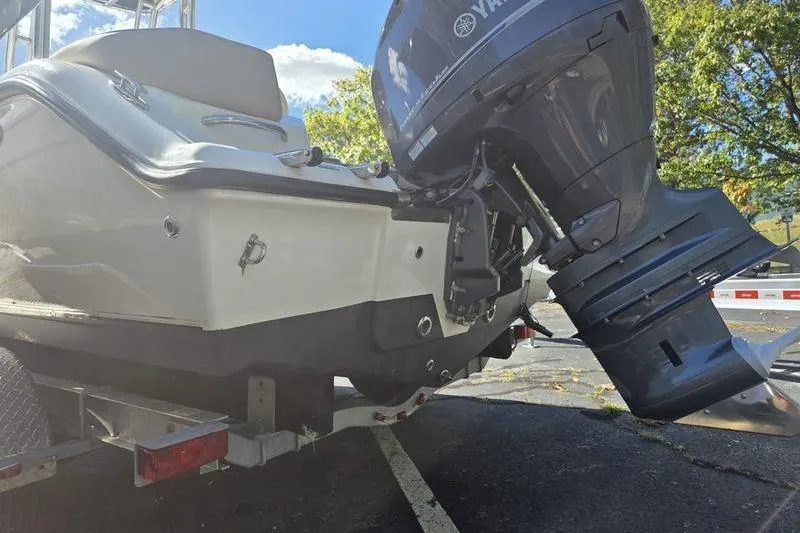 Slide: The Image of 2023 Key West 203 FS boat with Yamaha outboard motor on a trailer. - 7