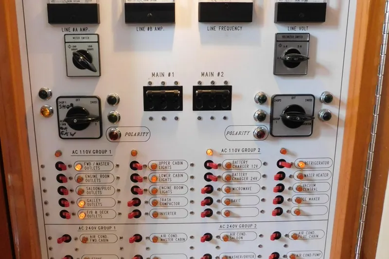 Slide: The Image of Interior of 2001 Jefferson Pilothouse 57 yacht with wooden desk and cabinetry. - 13