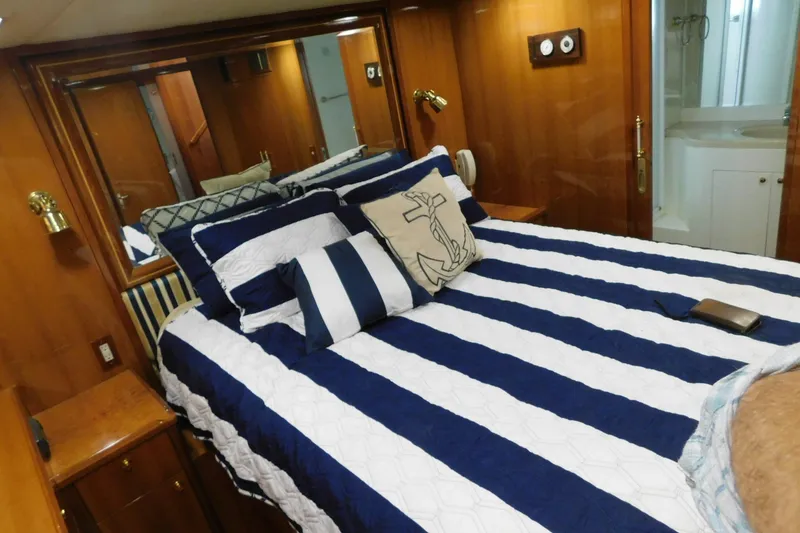 Slide: The Image of Interior of 2001 Jefferson Pilothouse 57 yacht with wooden cabinetry and staircase. - 15