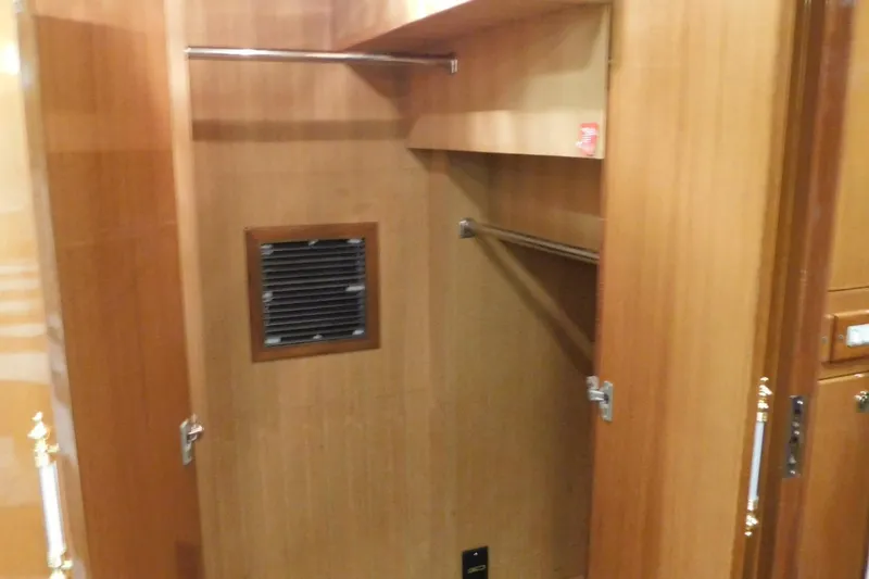 Slide: The Image of Luxurious bedroom interior of 2001 Jefferson Pilothouse 57 yacht with striped bedding. - 24