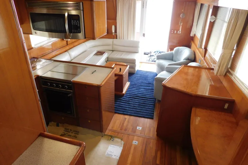 Slide: The Image of Luxurious bedroom interior of 2001 Jefferson Pilothouse 57 yacht with striped bedding and wood finishes. - 27