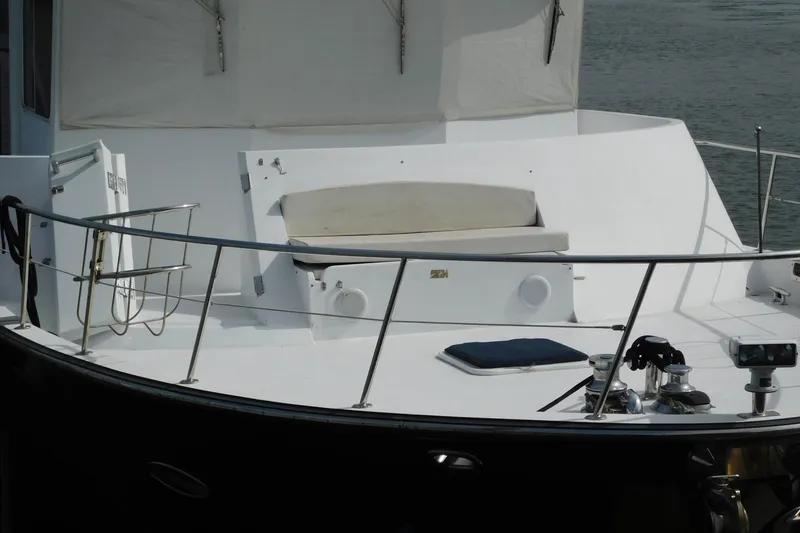 Slide: The Image of 2001 Jefferson Pilothouse 57 yacht deck with seating and railing. - 6