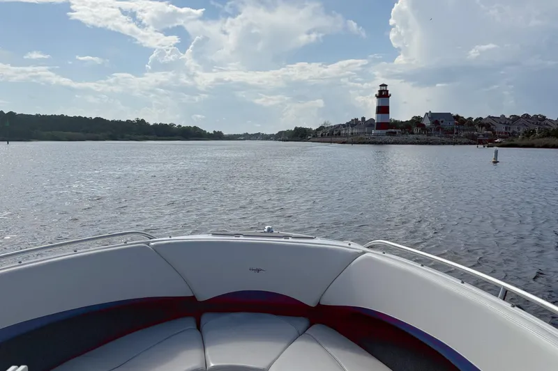 Slide: The Image of Bow view from 2000 Four Winns 260 Horizon boat, approaching lighthouse on a sunny day. - 16