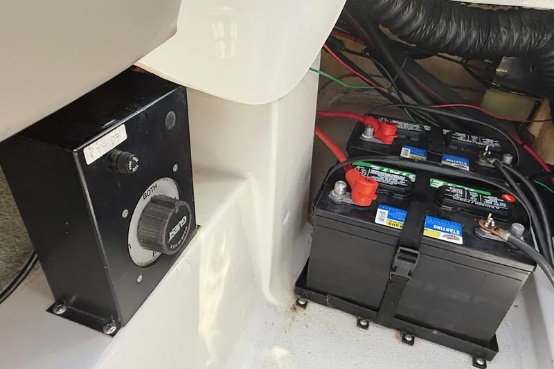 Slide: The Image of Battery compartment of a 2000 Four Winns 260 Horizon boat with dual batteries and switch. - 31