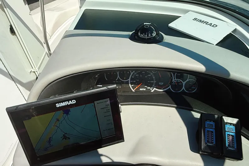 Slide: The Image of Dashboard of a 2000 Four Winns 260 Horizon boat with Simrad navigation system. - 34