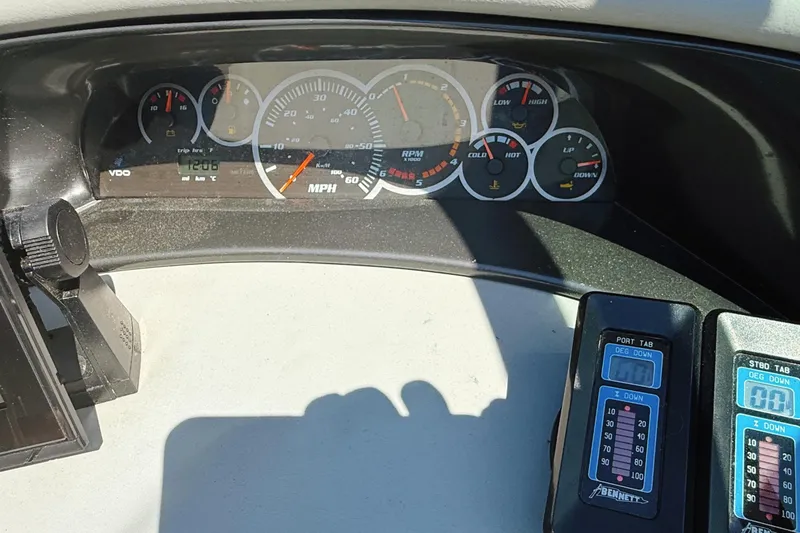 Slide: The Image of Dashboard of a 2000 Four Winns 260 Horizon boat with gauges and controls. - 35