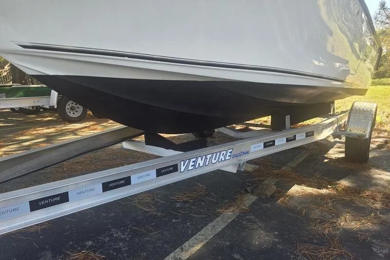 Slide: The Image of 2023 Key West 203 FS boat on Venture trailer in parking lot. - 12