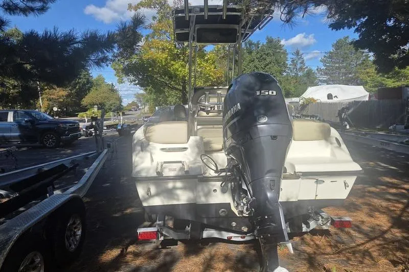 Slide: The Image of 2023 Key West 203 FS boat with Yamaha 150 engine on a trailer. - 6